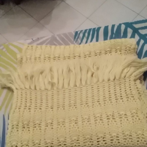 Knitted scarf handmade in soft yellow color with fringes