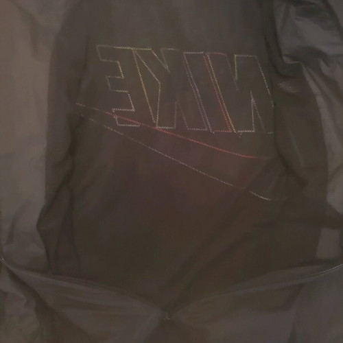 Nike unisex jacket used with colorful letters and small tear