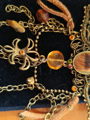 Ethnic style lapel pin like new with orange details