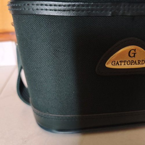 Toiletry bag used, green, fabric defect