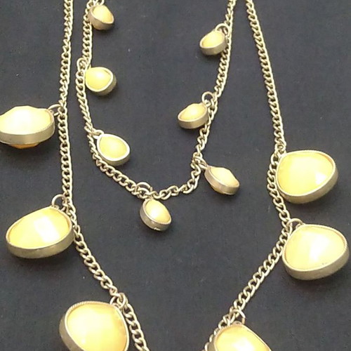 Double long necklace with matte gold chain and beige decorations