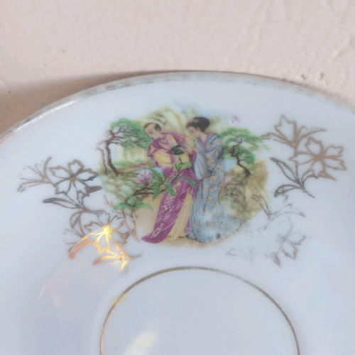 Porcelain vintage plates used, set of two with gold details