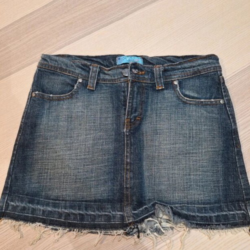 Denim skirt with rhinestone design on back