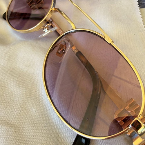 Miu Miu SMU 54ZS ZVN-70D sunglasses like new, gold frame, pink lenses