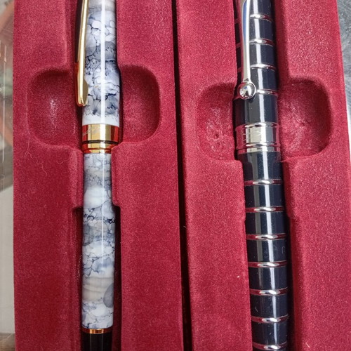 Pens in like-new condition with various designs