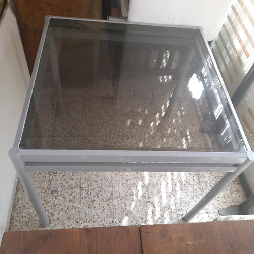 Square veranda table used with intact glass