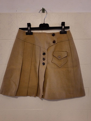 Beige mini skirt used with unique fastening and pleats size S