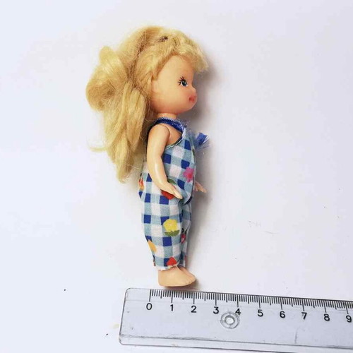 Plastic doll used with torn clothes