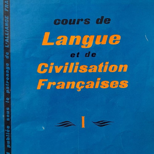 French language learning books used with handwritten notes