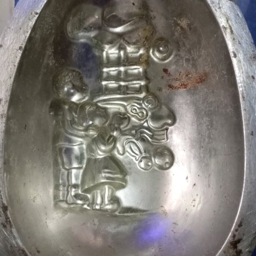 Easter mold used for chocolate egg with children and gifts design