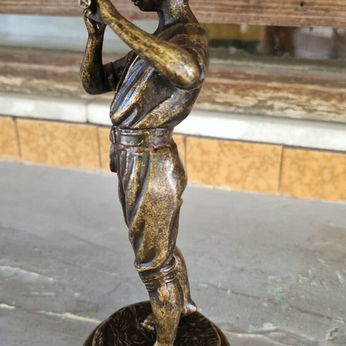 Vintage bronze sculpture of a boy playing flute used