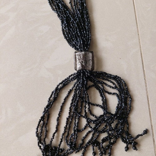 Necklace new with thin black beads and gray transparent stones