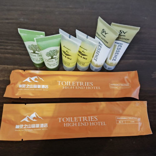 Travel bathroom product set like new with shower gel, shampoo, lotion, comb, toothbrush