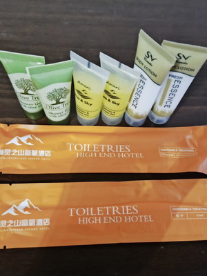 Travel bathroom product set like new with shower gel, shampoo, lotion, comb, toothbrush