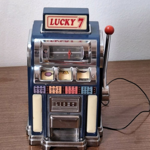 Marksman Las Vegas Lucky 7 AM/FM radio used, one armed bandit slot machine