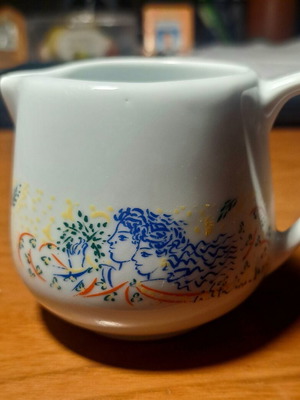 Collectible porcelain milk jug with artwork by Giorgos Stathopoulos used