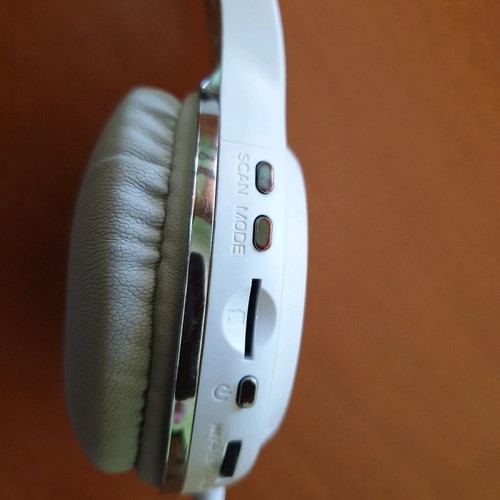 Bluetooth headphones used, white with MP3 and memory card options