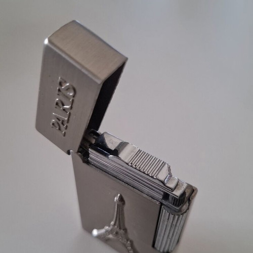 Gas lighter with Eiffel Tower design, like new