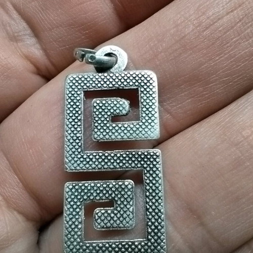 Pendant with double Meander like new, silver color