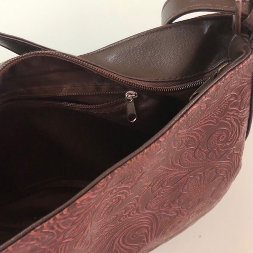 Women's brown shoulder bag used with embossed design