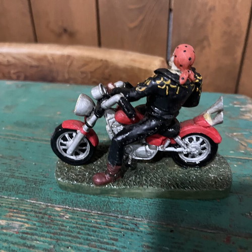 Vintage collectible biker figure on red motorcycle, like new