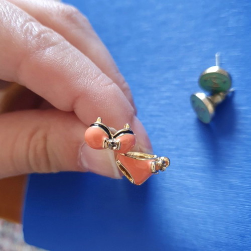 Unique earrings used with designs of swimsuits, rackets, sunglasses