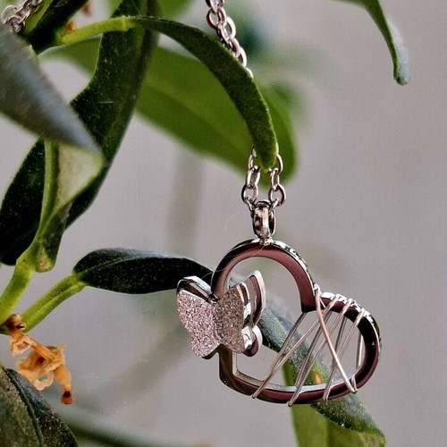 Heart necklace with 3D butterfly and adjustable chain, like new