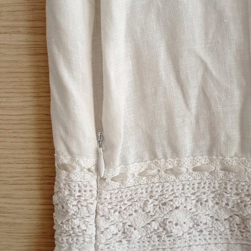 Long white dress used with lace and fake coins