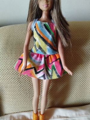 Barbie Fashionistas doll like new with colorful geometric dress and orange boots