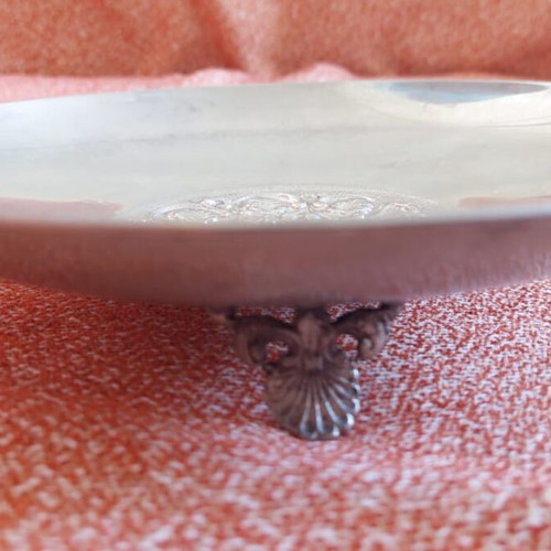 Silver-plated centerpiece bowl used with carved details and three feet