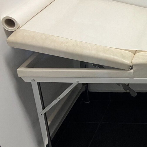 Folding examination bed for aesthetic treatments and massage