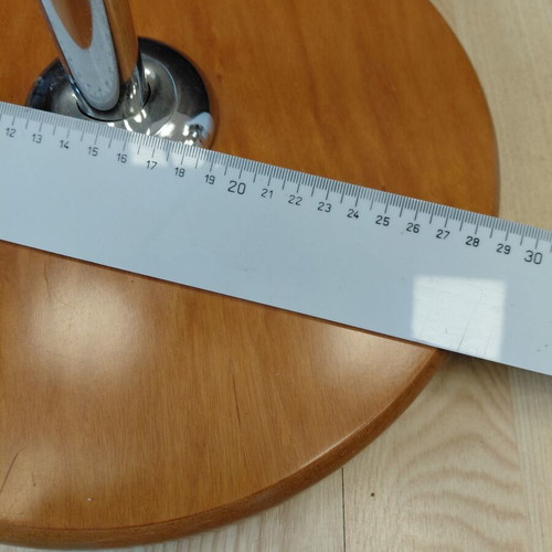 Metal three-tier countertop stand used with wooden base