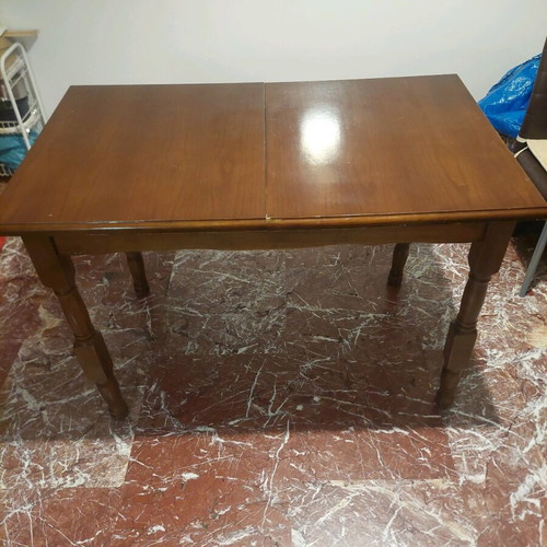 Wooden dining table with extension used