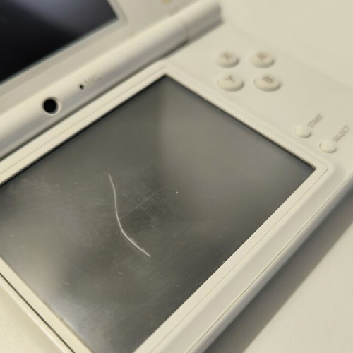 Nintendo DSi white console with 10 games and stylus used