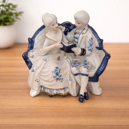 Vintage couple figurine reading on sofa rococo style like new