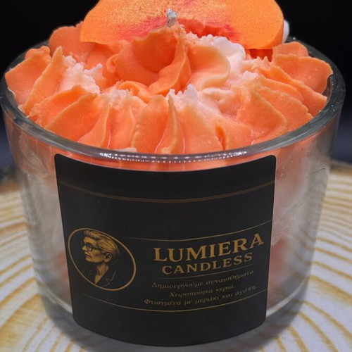 Handmade soy candle in glass container with peach scent