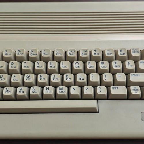 Commodore C64c personal computer with joystick and accessories