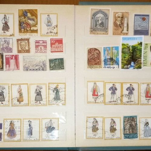 Book with collection of various Greek and foreign stamps used