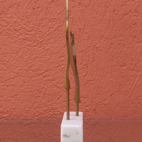 Brass sculpture used on marble base
