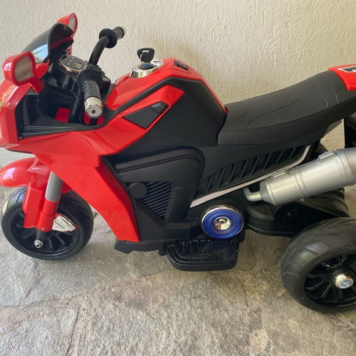 Electric children's motorcycle used with music
