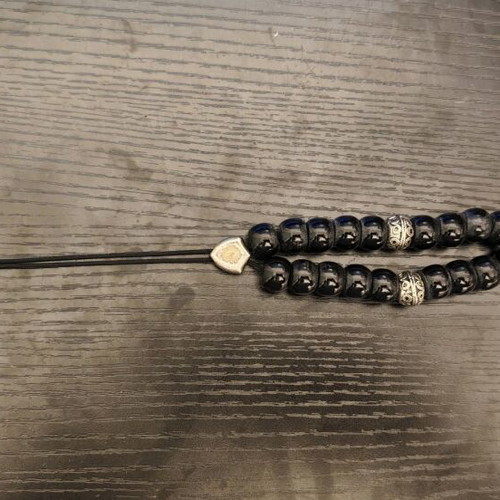Black worry beads used with metal details