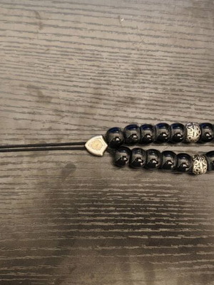 Black worry beads used with metal details
