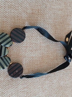 Necklace with unique loose tie at neck like new