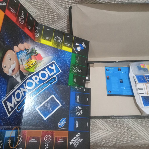 Monopoly board game used, missing one token