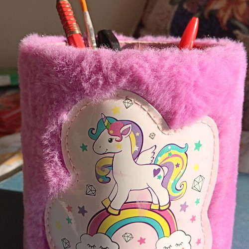 Fluffy pink pencil holder with unicorn design