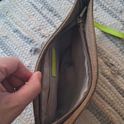 Leather wristlet bag with fluorescent details, Italy