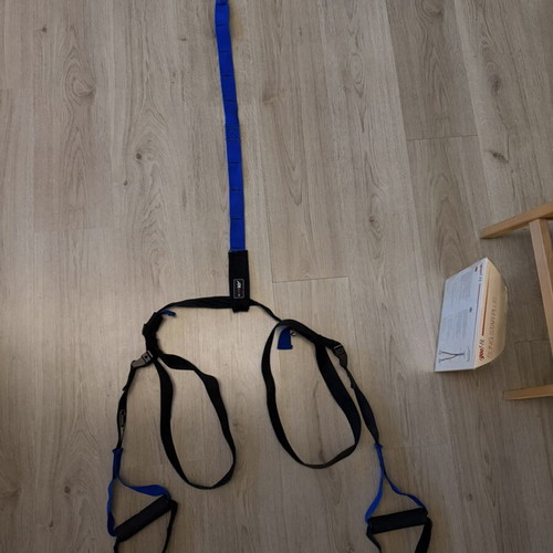 TRX strap used, blue color without ceiling hook