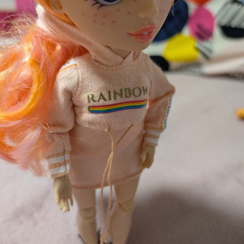 Rainbow High Poppy Rowan Fashion Doll with 2 Mix & Match Outfits, like new