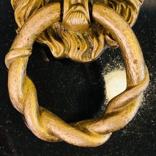 Bronze door knocker used with lion head and wooden base