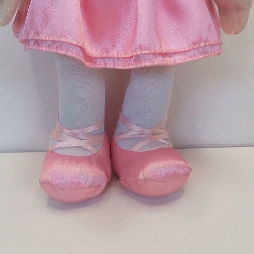 Vintage Uneeda doll with pink clothes, blond hair, blue eyes used